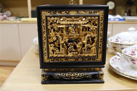 A late 19th/early 20th century Chinese giltwood and black lacquer incense stand